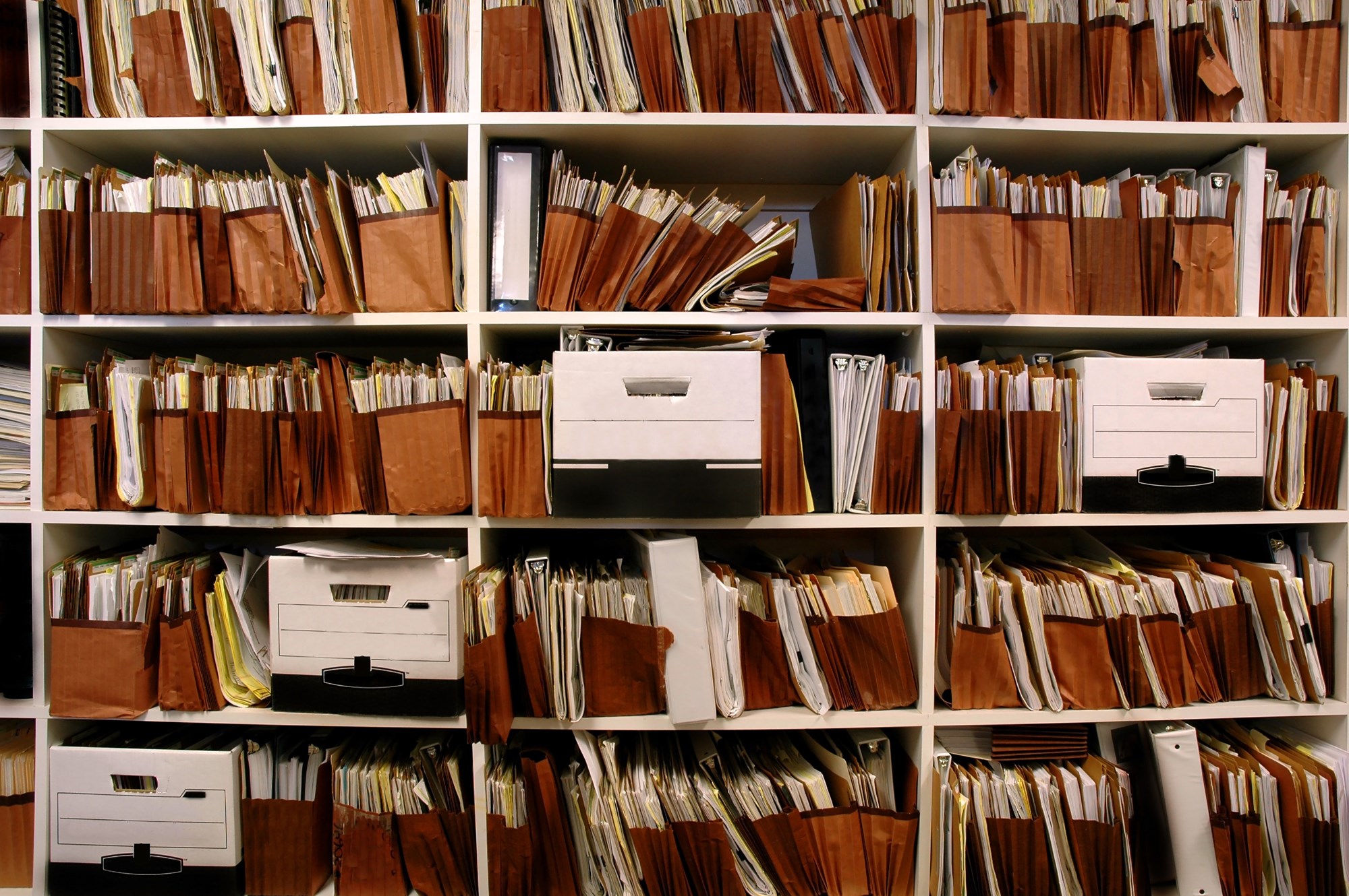 Office shelves full of files and boxes