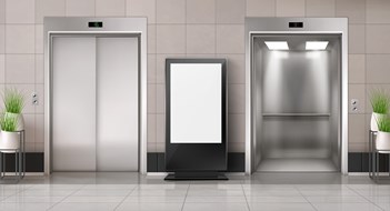 Capital Design Projects Office hallway with LCD screen floor stand, open and closed elevator doors. Vector realistic empty lobby interior with lift, plants and blank advertising display. White billboard with copy space
