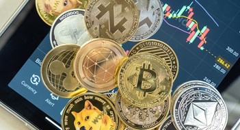 Real Estate, Cryptocurrency, & Taxes Bangkok, Thailand - 1 July 2021: Cryptocurrency on Binance trading app, Bitcoin BTC with altcoin digital coin crypto currency, BNB, Ethereum, Dogecoin, Cardano, defi p2p decentralized fintech market