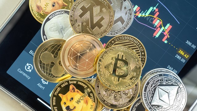 Bangkok, Thailand - 1 July 2021: Cryptocurrency on Binance trading app, Bitcoin BTC with altcoin digital coin crypto currency, BNB, Ethereum, Dogecoin, Cardano, defi p2p decentralized fintech market