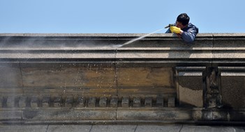 Shanghai, China - March 26: Exterior cleaning and building cleaning with high pressure water jet on March 26, 2016 in Shanghai, China. Shanghai is the largest Chinese city by population.