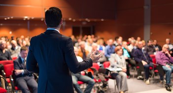 Property Manager Education & Training Speaker at Business Conference and Presentation. Audience at the conference hall.