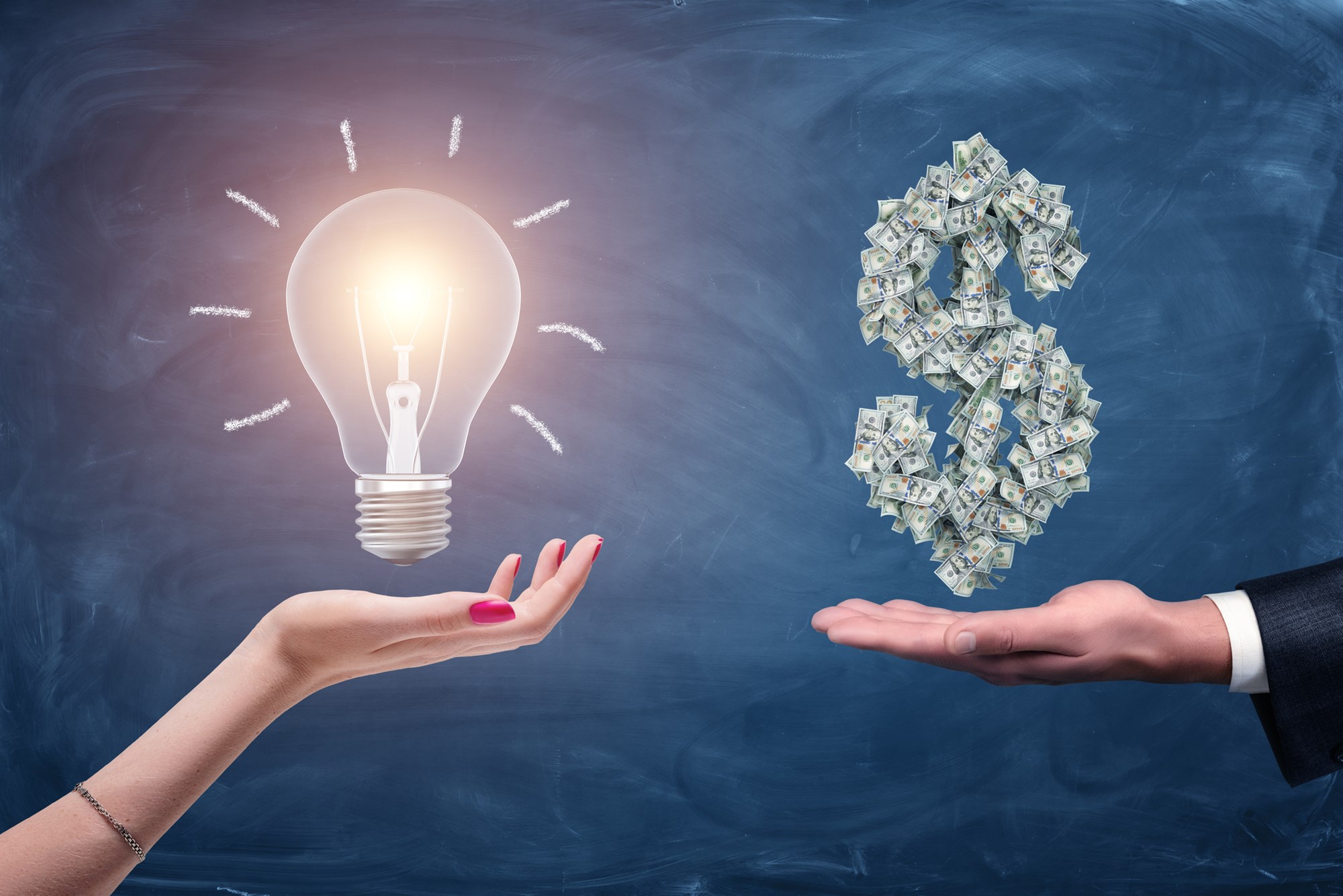 A female and a male hands holding a large bright light bulb and a dollar sign made of many money bills. Money and wealth. Profitable ideas. Financial streak.