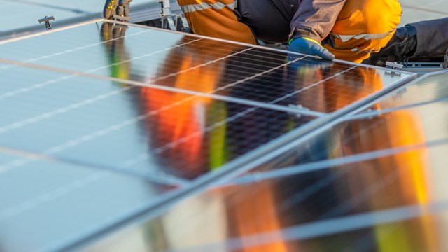Solar panels installation on rooftop, ideal for any renewable article or wallpaper