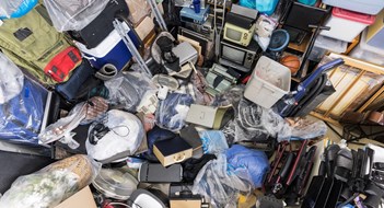 Respecting Rules & Rights Hoarder house junk pile of clothing bags, household objects, vintage electronics and miscellaneous objects.