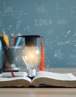 Graduation cap with a lightbulb on the book and globe in the classroom. Education learning concepts in school or university. Idea knowledge of innovative technology, science, and mathematics.