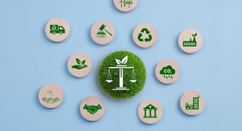 Local Laws & Energy Conservation Environmental Law, International environmental policy. Wooden block on a blue background with green icons. sustainability. Eco friendly law, climate protection, sustainable energy policy.