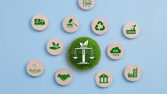 Environmental Law, International environmental policy. Wooden block on a blue background with green icons. sustainability. Eco friendly law, climate protection, sustainable energy policy.