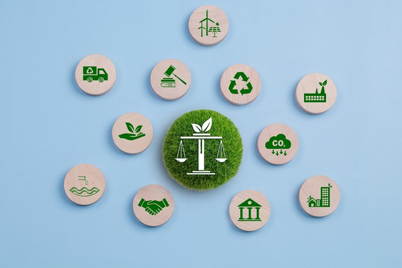Environmental Law, International environmental policy. Wooden block on a blue background with green icons. sustainability. Eco friendly law, climate protection, sustainable energy policy.