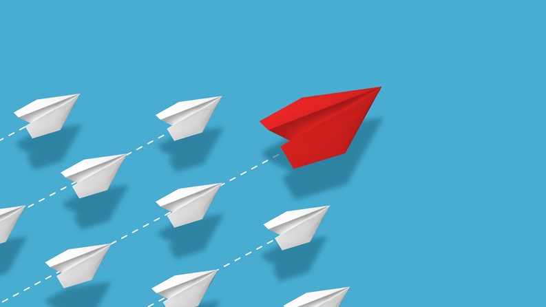Creative collage. Red paper plane leading multiple white planes on blue background with dotted flight paths. Concept of leadership, innovation, direction, uniqueness, and creative business strategy.